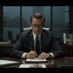 lucid-origin_executive_reviewing_documents_dark_office_cinematic_16_9-6