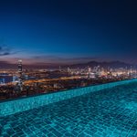 lucid-origin_infinity_pool_overlooking_city_lights_night-3