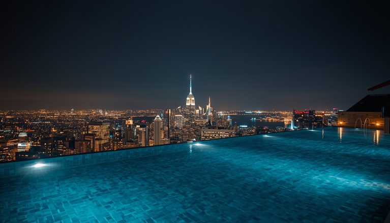 lucid-origin_infinity_pool_overlooking_city_lights_night-6