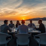 lucid-origin_business_professionals_yacht_meeting_sunset_luxury_16_9-5